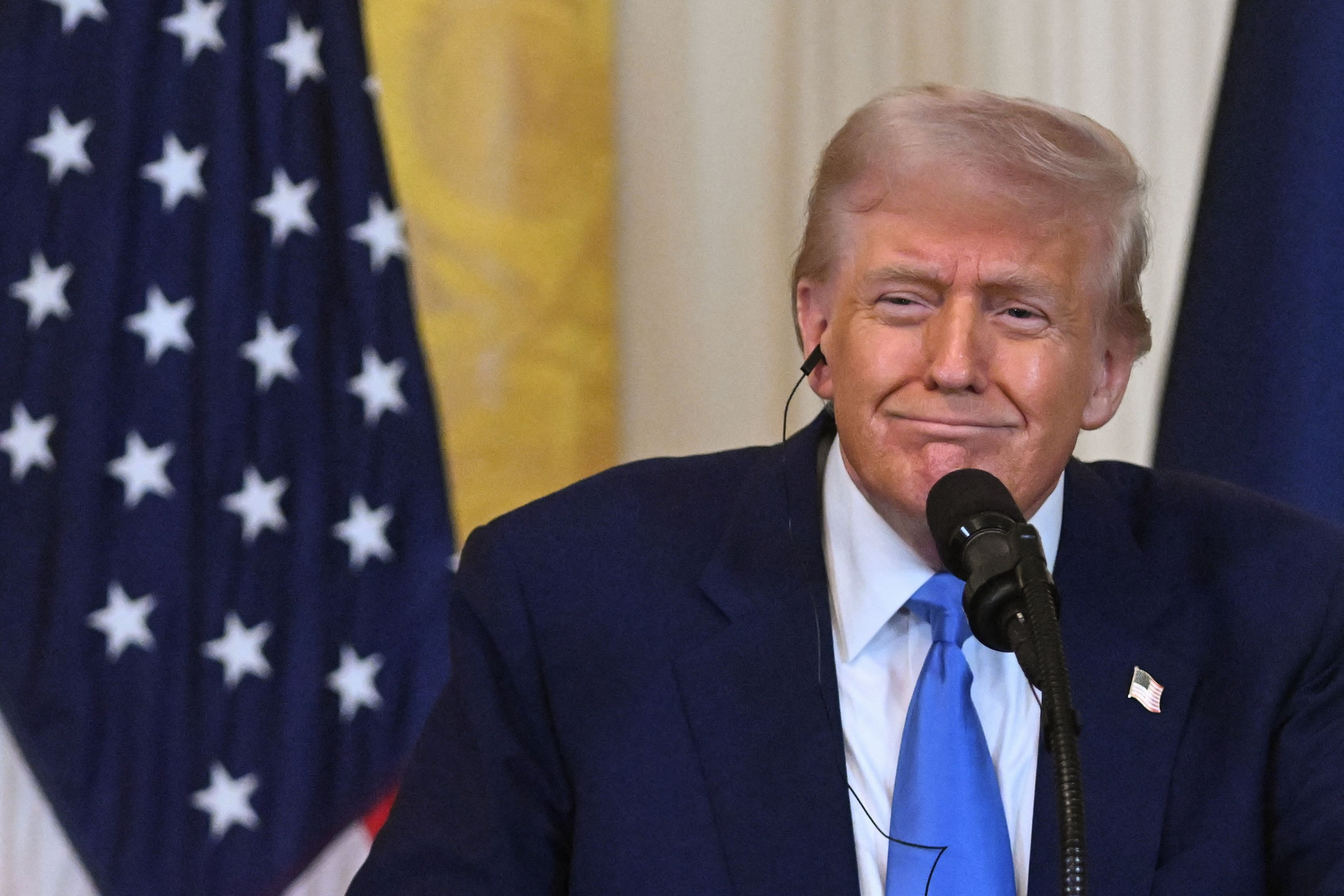 U.S. President Donald Trump listens as French President Emmanuel Macron speaks during a joint press conference in the East Room to the White House in Washington, D.C., on Feb. 24. [AFP/YONHAP] 