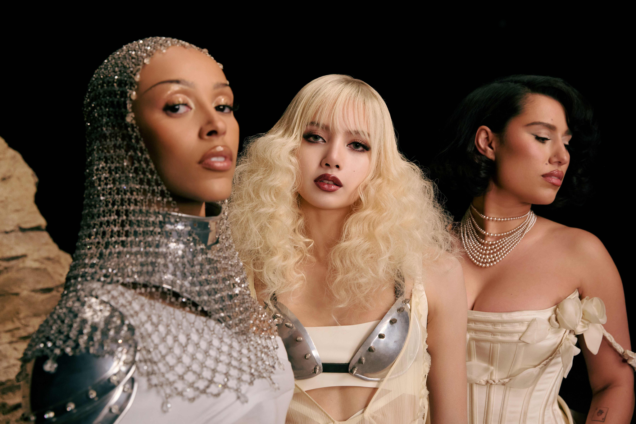 From left are American rapper Doja Cat, Lisa of the K-pop girl group Blackpink and British singer-songwriter Raye featured in a promotional photo for Lisa's prereleased single ″Born Again″ [SONY MUSIC ENTERTAINMENT KOREA]