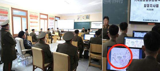 North Korean leader Kim Jong-un, third from left, observes a class of students during his visit to the Kim Il Sung University of Politics, the supreme military and political school of the armed forces, in Pyongyang on Feb. 24, 2025, in this photo released by the North's official Korean Central News Agency the next day. A classroom blackboard and monitors display the topic "Party Political Work During Mechanized Infantry Brigade Assault Operations," while a student's monitor shows a map resembling the city of Sacheon in South Korea. [NEWS1]