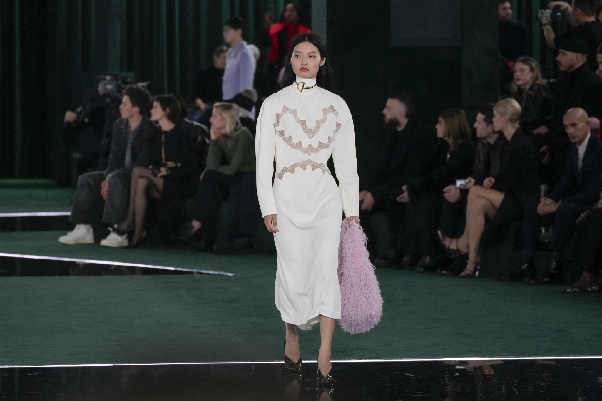 A model wears a creation as part of the Gucci Fall/Winter 2025-2026 men's and women's collection, presented in Milan, Italy, on Feb. 25. [AP/YONHAP] 