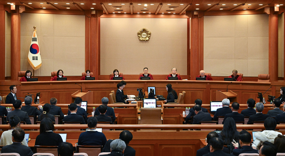 The 11th and final hearing of President Yoon Suk Yeol's impeachment trial takes place at the Constitutional Court in Jongno District, central Seoul, on Feb. 25. Representatives for the National Assembly are seated on the far right, opposite Yoon's lawyers. [JOINT PRESS CORPS]