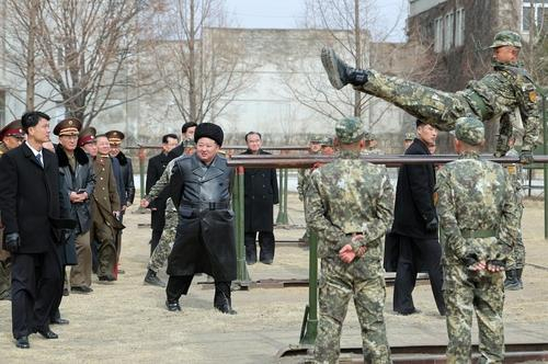 North Korean leader Kim Jong-un, center, inspects the Kang Kon Military Academy, in this photo captured from the Rodong Sinmun, North Korea's daily newspaper for general readers. [SCREEN CAPTURE]