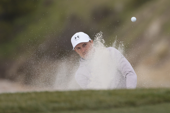 Jordan Spieth hits out of the bunker on the sixth hole during the second round of the AT&T Pebble Beach Pro-Am 2025 at Pebble Beach Golf Links in Pebble Beach, California on Jan. 31.  [AP/YONHAP]