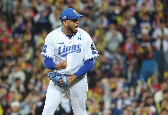 Samsung Lions starting pitcher Denyi Reyes roars as he finishes an inning during game 3 of the 2024 Korean Series between against the KiaTigers at Daegu Samsung Lions Park in Daegu on Oct. 25., 2024. [YONHAP]