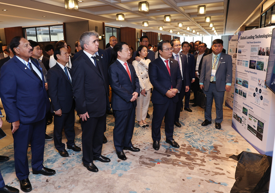 Korea Water Resources Corporation CEO Yun Seog-dae, center in the front row, looks at K-water's advanced water management technologies presented on a panel during the Asia Water Council board meeting in Phnom Penh, Cambodia, on Feb. 27. [K-WATER]