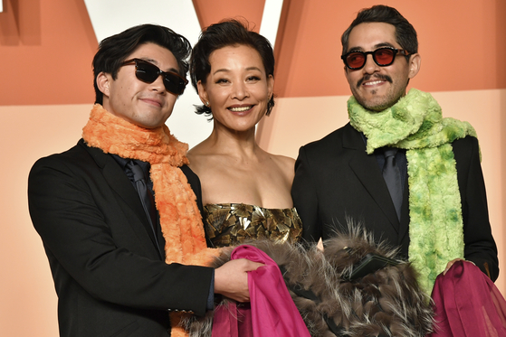 Sean Wang, Joan Chen and Carlos Lopez Estrada arrive at the Vanity Fair Oscar Party on March 2, at the Wallis Annenberg Center for the Performing Arts in Beverly Hills, California. [AP/YONHAP]