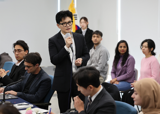 International students are seen at a meeting held at Ulsan National Institute of Science & Technology, one of the leading science universities in Korea, in November 2023. Then-Justice Minister Han Dong-hoon is seen in the photo while grabbing a microphone. [YONHAP] 