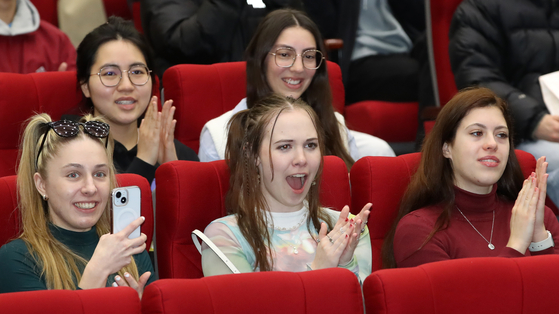 International students enjoy a performance of Taekwondo, Korean martial arts, during their orientation session at Pukyong National University in Busan on Feb. 28. [NEWS1] 