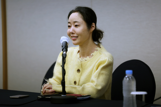 ADOR CEO Min Hee-jin smiles during Friday's press conference. [JOINT PRESS CORPS]