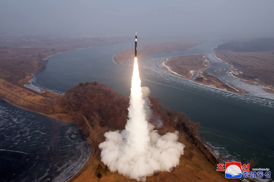 A photo released by the official North Korean Central News Agency (KCNA) shows the launch of an intermediate-range ballistic missile (IRBM) with a hypersonic warhead as payload at an undisclosed location in North Korea, on Jan. 6. [EPA/YONHAP]