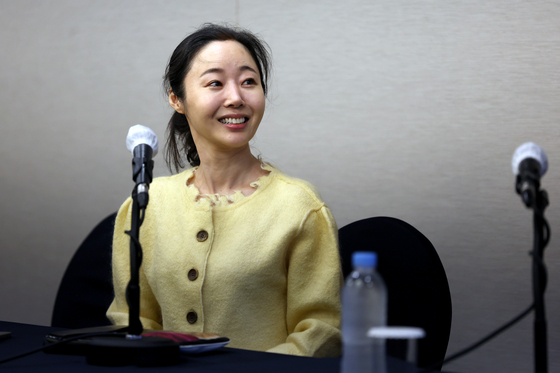 ADOR CEO Min Hee-jin smiles during Friday's press conference. [JOINT PRESS CORPS]