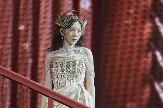 Taeyeon descends a staircase on stage during ″Fabulous″ (2024), the first song of her solo concert, ″The Tense,″ at the KSPO Dome in Songpa District, southern Seoul, held from March 7 to 9. [SM ENTERTAINMENT]