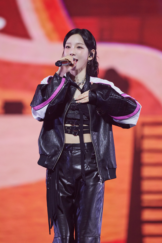 Taeyeon talks to the audience during her solo concert, ″The Tense,″ at the KSPO Dome in Songpa District, southern Seoul, held from March 7 to 9. [SM ENTERTAINMENT]