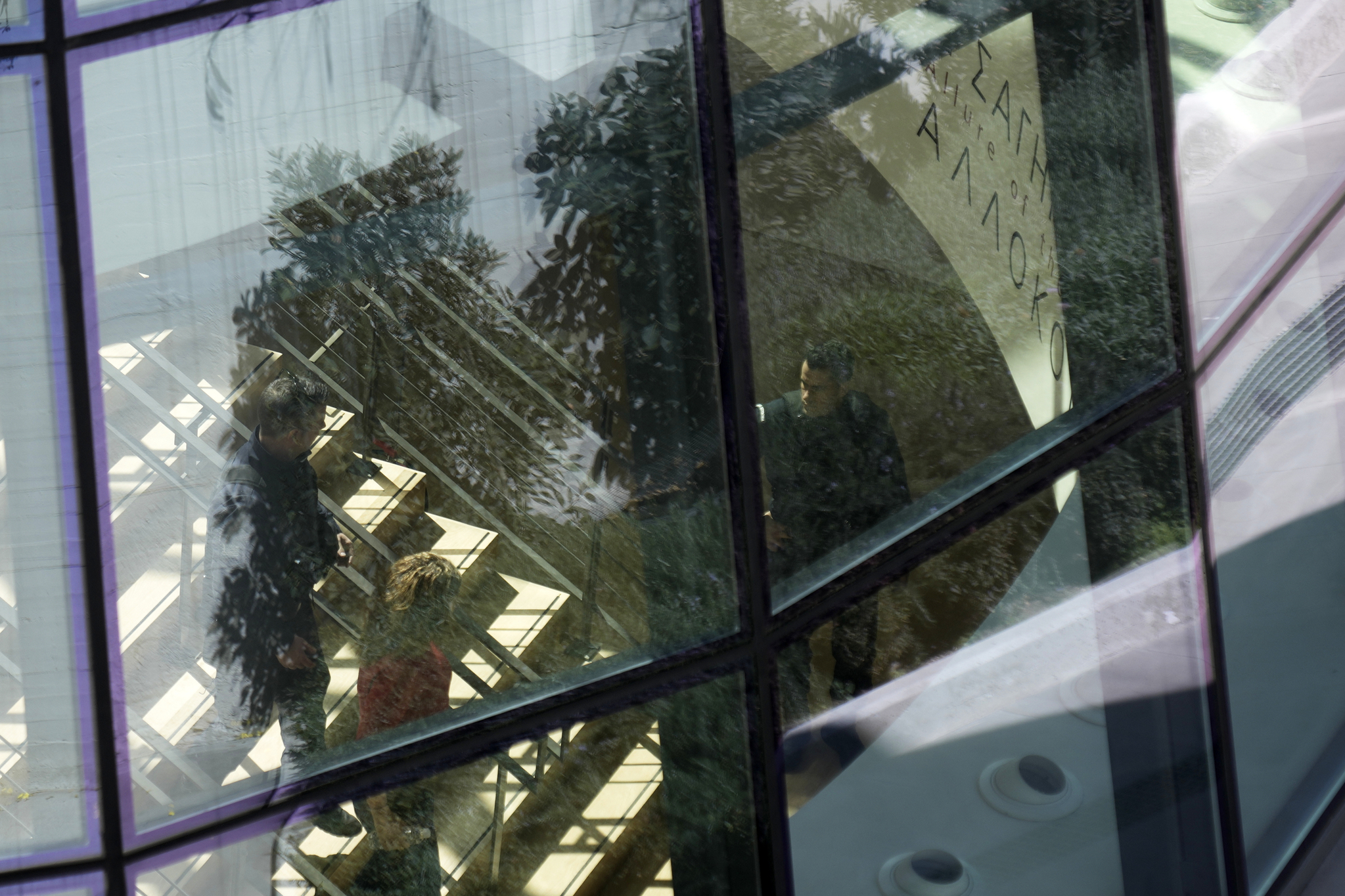 Greek police officers walk inside the National Gallery as Nikolaos Papadopoulos, member of parliament of the small right-wing Niki party, was detained after he allegedly attacked art works being hosted at an exhibition in Athens on March 10. [AP/YONHAP]