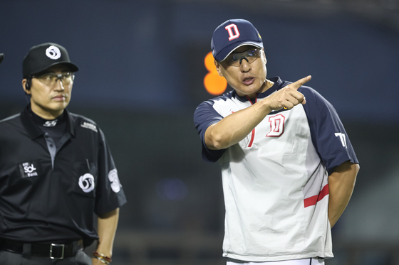 Doosan Bears manager Lee Seung-yuop, right, during the 2024 Shinhan SOL Bank KBO League game against the Samsung Lions in Songpa-gu, Seoul, on March 12. 2024. [NEWS1]