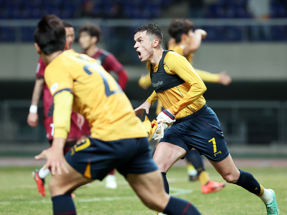 Gwangju FC forward Jasir Asani, right, celebrates scoring during the second leg of the 2024-25 AFC Champions League Elite round of 16 against Vissel Kobe at Gwangju World Cup Stadium in Gwangju on March 12. [YONHAP] 