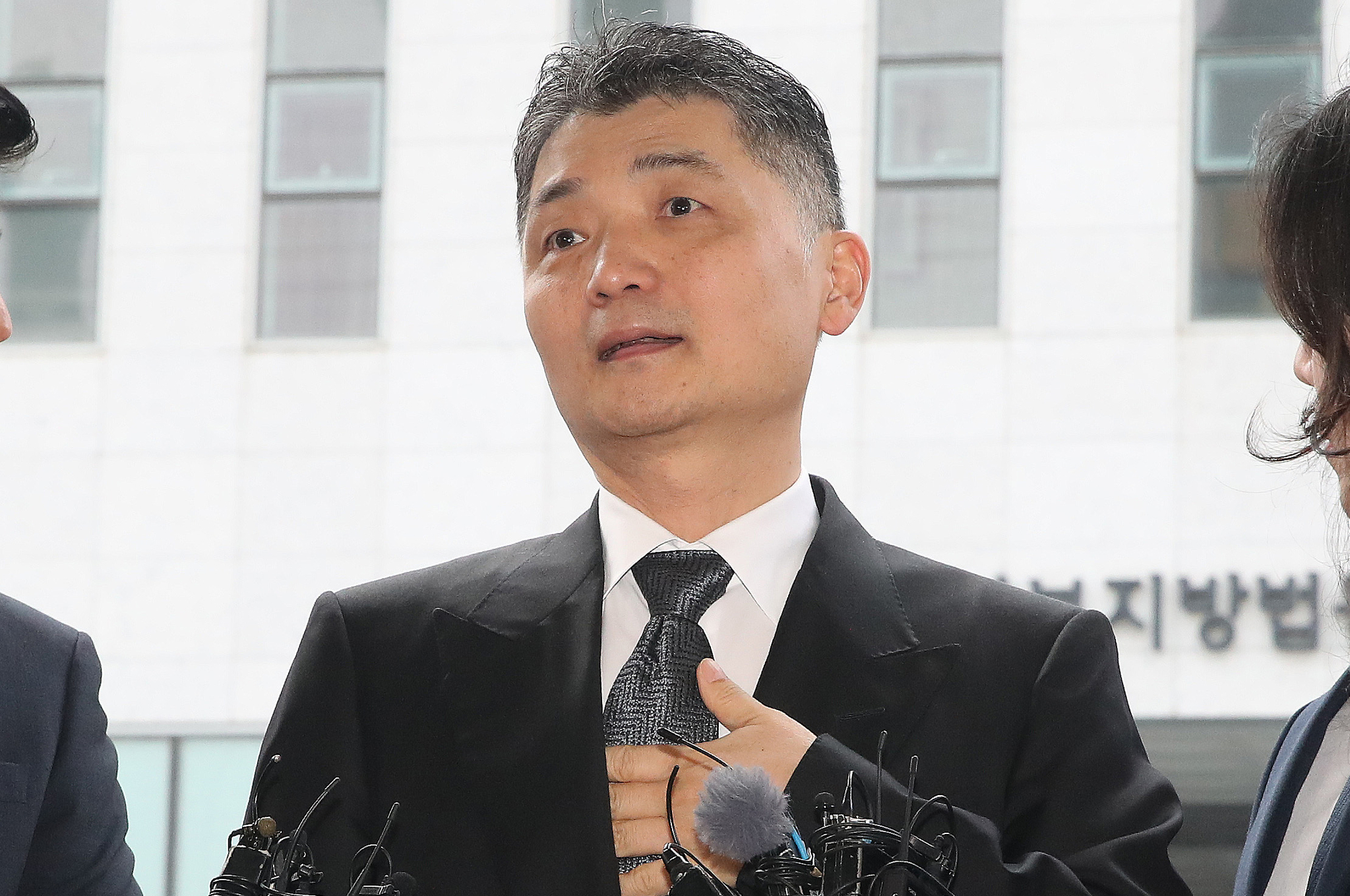 Kakao founder Kim Beom-su answers questions from press before entering the Seoul Southern District Court in western Seoul on Nov. 15, 2024. [NEWS1] 