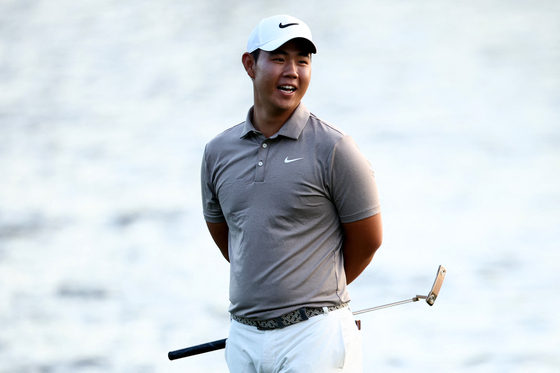 Tom Kim looks on from the 18th hole during the first round of The Players Championship on the Stadium Course at TPC Sawgrass on March 13 in Ponte Vedra Beach, Florida. [AFP/YONHAP]