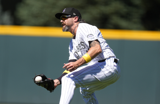 Colorado Rockies right fielder Jake Cave tracks down a single off the bat of Baltimore Orioles' Cedric Mullins in the fourth inning of a baseball game on Sept. 1, 2024, in Denver. [AP/YONHAP]