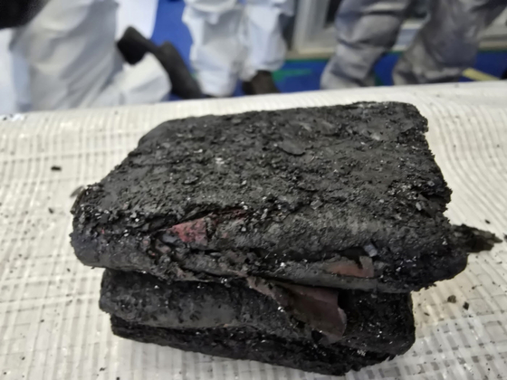 The debris of burnt portable battery, which was obtained from under the seats of row 31 on the Air Busan aircraft, is seen in this photograph. [MINISTRY OF LAND, INFRASTRUCTURE AND TRANSPORT] 