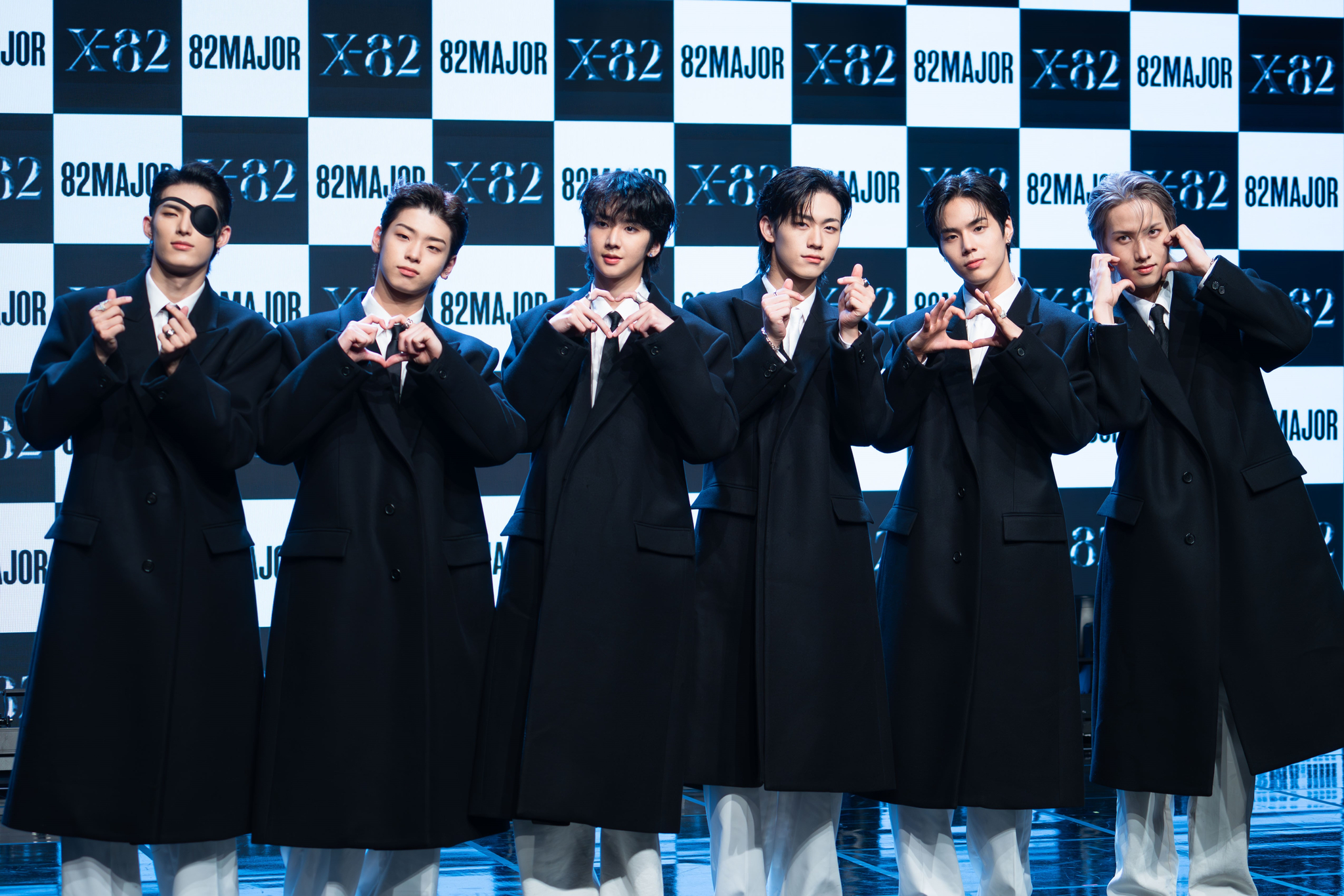 Boy band 82Major members pose for photos during a showcase on Oct. 15, 2024, at the Ilchi Art Hall in southern Seoul. [DANIELA GONZALEZ PEREZ]