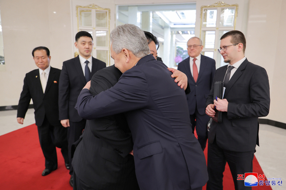 North Korean leader Kim Jong-un and Sergei Shoigu, secretary of the Russian State Security Council, embrace during Shoigu's visit to Pyongyang on March 22. [YONHAP]
