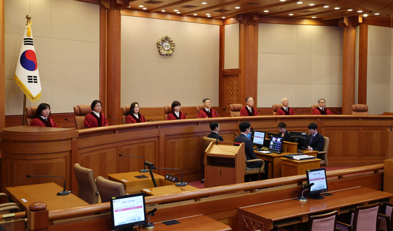 Justices sit in the main chamber of the Constitutional Court in Jongno District, central Seoul, on March 24. [JOINT PRESS CORPS]