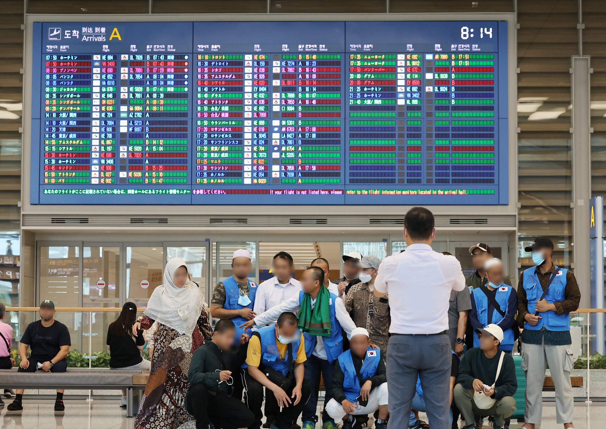 Migrant workers arrive at Incheon International Airport in July 2022. [YONHAP]