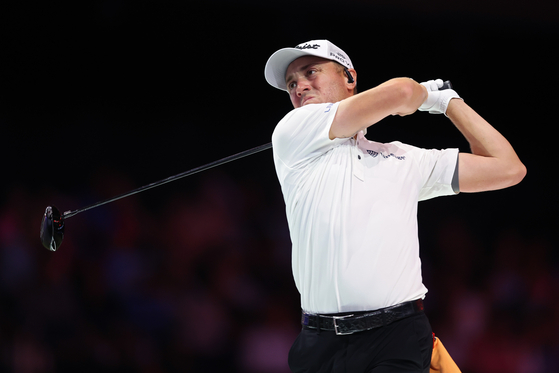 Justin Thomas of Atlanta Drive GC hits a shot on the fourth hole during their second TGL final match against New York Golf Club at the SoFi Center in Florida on March 25. [TGL] 