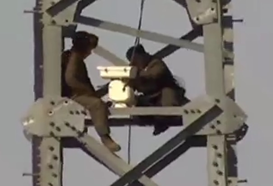 North Korean soldiers set up a surveillance camera on Tower No. 34 along the Gyeongui Line, just north of the Military Demarcation Line, in this image released by South Korea’s Joint Chiefs of Staff on March 27. [NEWS1]