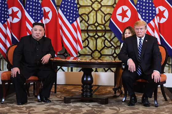 North Korean leader Kim Jong-un, left, and then-president Donald Trump hold a summit in Hanoi, Vietnam, in Feb. 28, 2019. [YONHAP]