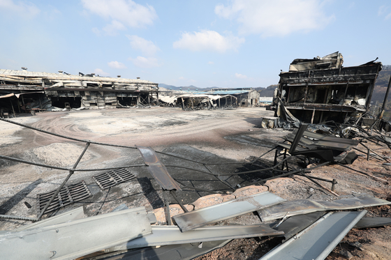 A factory building and materials in the Namhu Agricultural and Industrial Complex in Andong, North Gyeongsang, are seen after being burned by wildfires on March 31. [YONHAP]