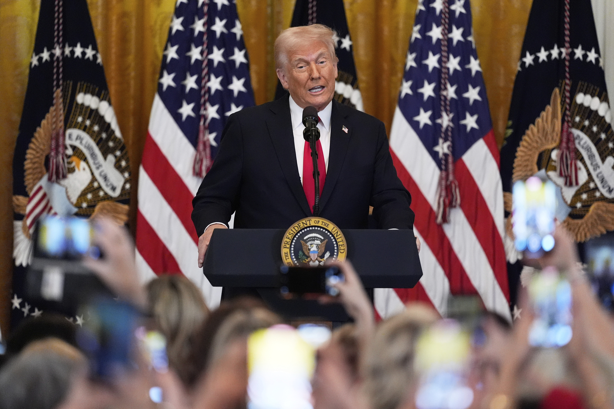 U.S. President Donald Trump speaks at a reception celebrating Women's History Month in the East Room of the White House, on March 26 in Washington. [AP/YONHAP]
