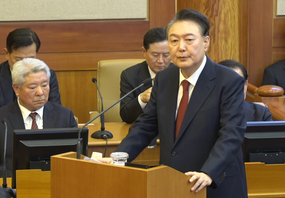 President Yoon Suk Yeol, right, delivers his closing statement at the 11th and final hearing of his impeachment trial at the Constitutional Court in Jongno District, central Seoul, on Feb. 25. [CONSTITUTIONAL COURT]