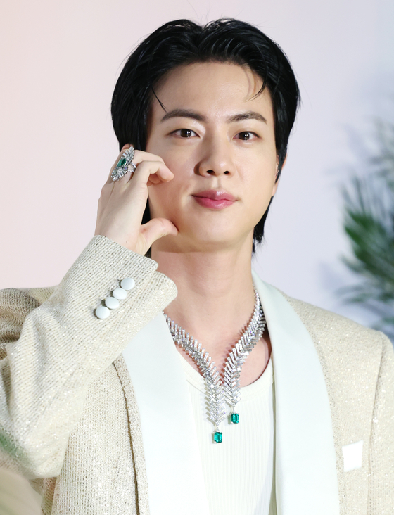 Jin of boy band BTS poses for photos at a fashion event in southern Seoul on March 13. [NEWS1]