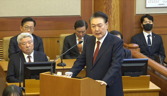 President Yoon Suk Yeol, right, delivers his closing statement at the 11th and final hearing of his impeachment trial at the Constitutional Court in Jongno District, central Seoul, on Feb. 25. [CONSTITUTIONAL COURT] 
