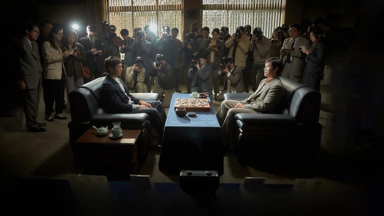 Actors Yoo Ah-in, center left, and Lee Byung-hun in the film ″The Match″ (2025) [JOONGANG ILBO]
