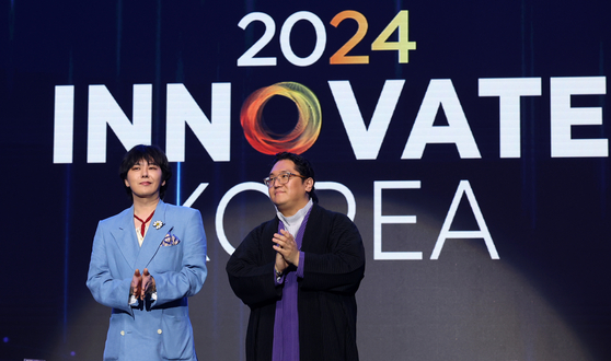 G-Dragon, left, attends the Innovate Korea 2024 forum at KAIST on June 5, 2024. [YONHAP] 