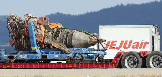 A truck carrying the engine of Jeju Air flight that crashed on Dec. 29, 2024 is being moved at the Muan International Airport on Jan. 4. [NEWS1]