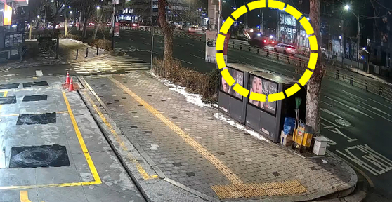 A car crashes into a excavator in Mapo District, western Seoul, on Dec. 27, 2023. [MAPO POLICE PRECINCT]
