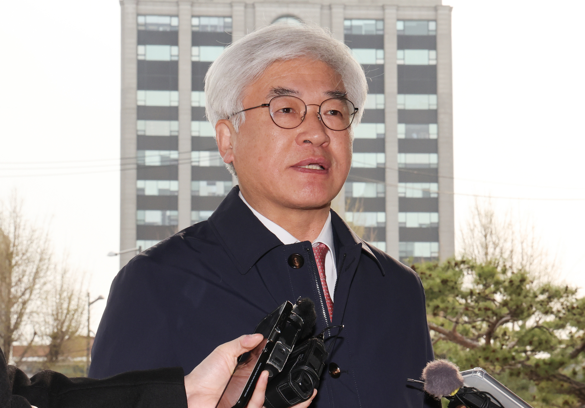 Ma Eun-hyuk, a newly appointed Constitutional Court justice, speaks to reporters as he arrives for work at the court in central Seoul on April 9. [YONHAP]