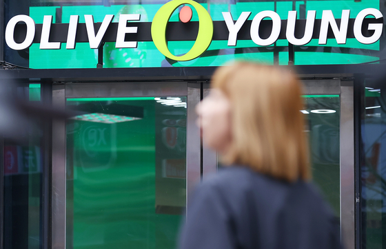 A pedestrian walks by a Olive Young branch in Seoul on March 12. [YONHAP] 