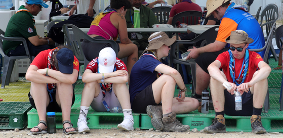 Scouts escape the heat near tents at the World Scout Jamboree in Buan County, North Jeolla on Aug. 4, 2023. [NEWS1]
