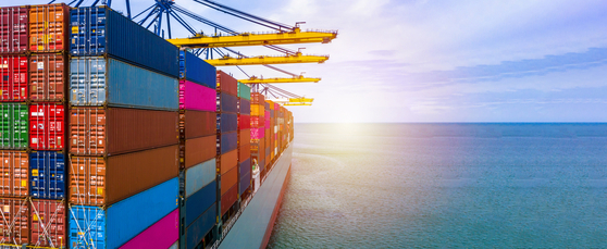 A container ship carrying containers in an import-export with a quay crane; the photo is not related to the article. [YONHAP]