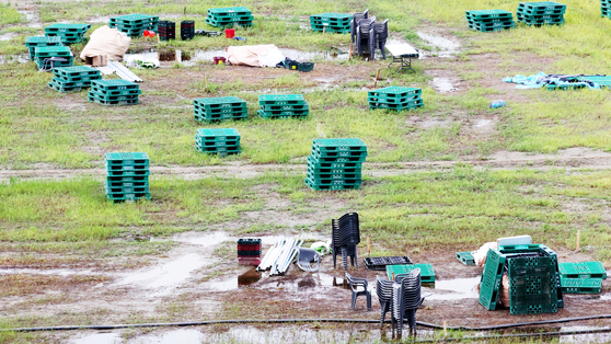 Puddles of water are seen across the 2023 World Scout Jamboree campsite in Saemangeum, North Jeolla, after Typhoon Khanun passed by on August 11. [YONHAP] 