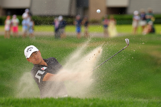Kevin Yu plays a shot from a bunker on the 15th hole during the final round of the Valspar Championship 2025 at Innisbrook Resort and Golf Club on March 23 in Palm Harbor, Florida. [GETTY IMAGES]