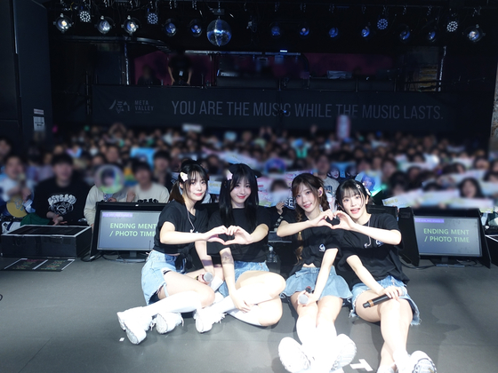 Rock band QWER poses for photos after its first fan concert, “1, 2, QWER!,” in Osaka on April 10. [TAMAGO PRODUCTION]