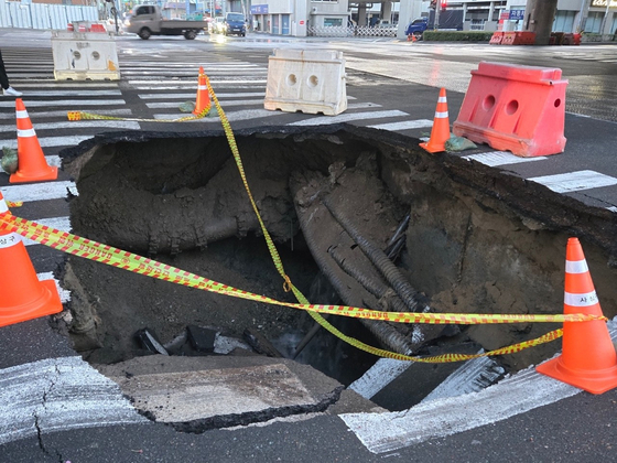 A sinkhole appears near a rail construction site in Busan on April 13. [SASANG-GU OFFICE]