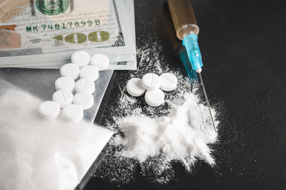 Cocaine and other drugs on a black background. Image is not related to the article. [GETTY IMAGES] 