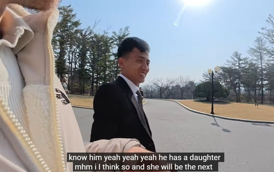 A North Korean guide answer's questions in a video posted on April 9. [SCREEN CAPTURE]